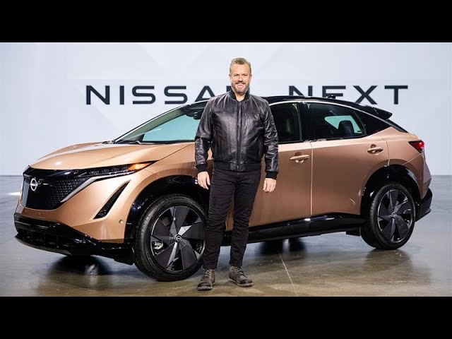 Ken Paul Smith, Automotive Product Specialist, stands in front of Nissan vehicle