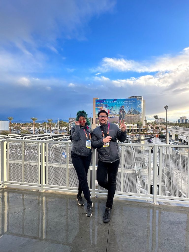 Two event staff members standing on a balcony